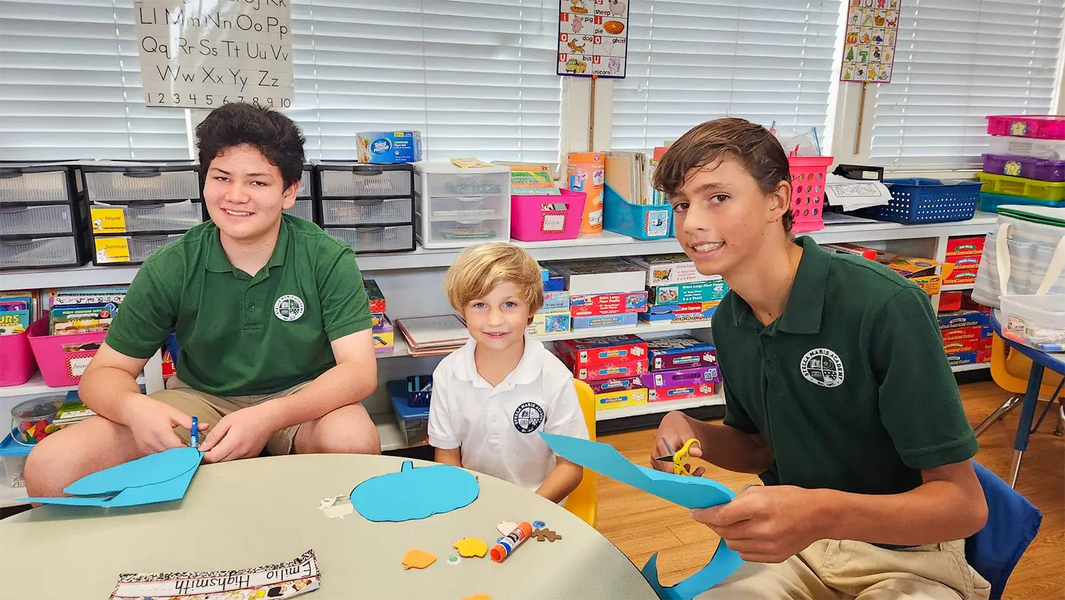 Older students working with a younger student